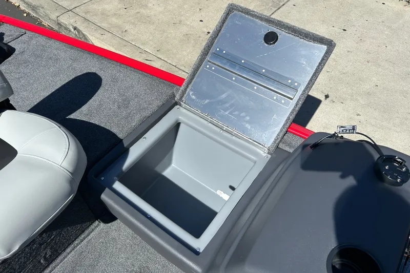 Slide: The Image of Open storage compartment on 2027 Tracker Bass Tracker Classic XL boat deck. - 13