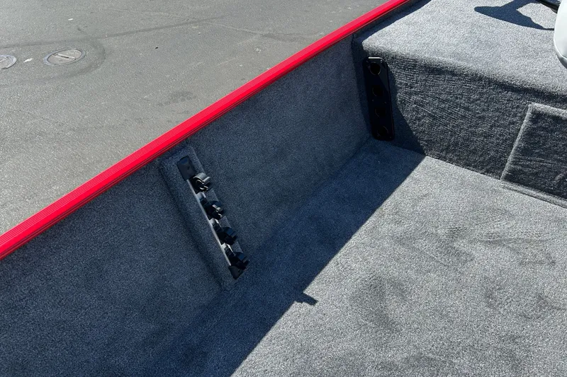 Slide: The Image of Interior of 2027 Tracker Bass Tracker Classic XL boat with gray carpet and red trim. - 16