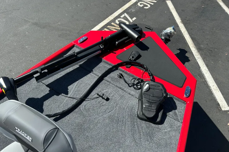 Slide: The Image of 2027 Tracker Bass Tracker Classic XL boat deck with trolling motor and foot pedal. - 14