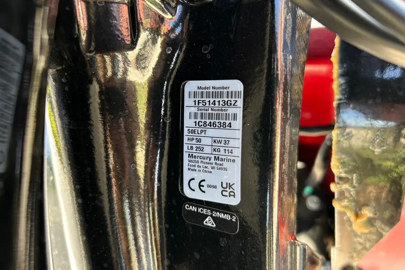 Slide: The Image of Label on a 2027 Tracker Bass Tracker Classic XL boat engine, showing model and serial numbers. - 68