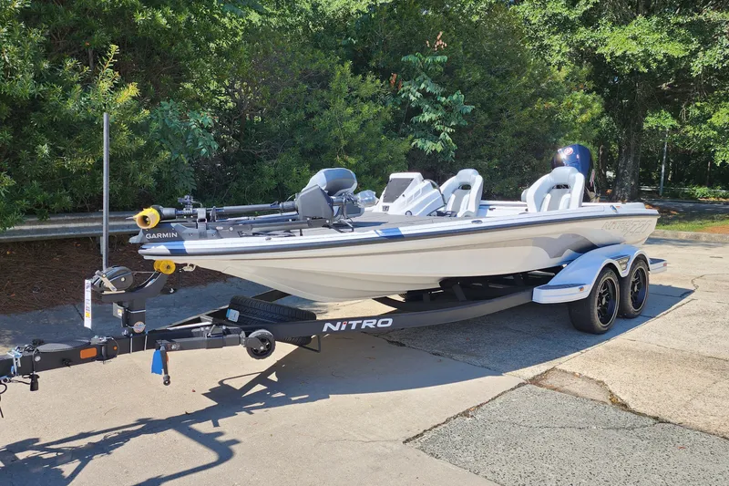 Slide: The Image of 2027 Nitro Z20 XL Pro boat on trailer, featuring Garmin equipment, parked outdoors. - 1