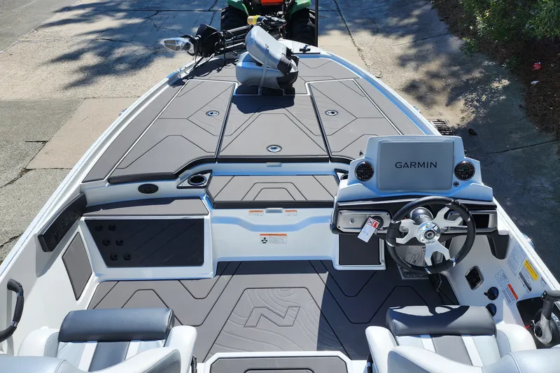 Slide: The Image of 2027 Nitro Z20 XL Pro boat interior with Garmin navigation system and sleek seating. - 3