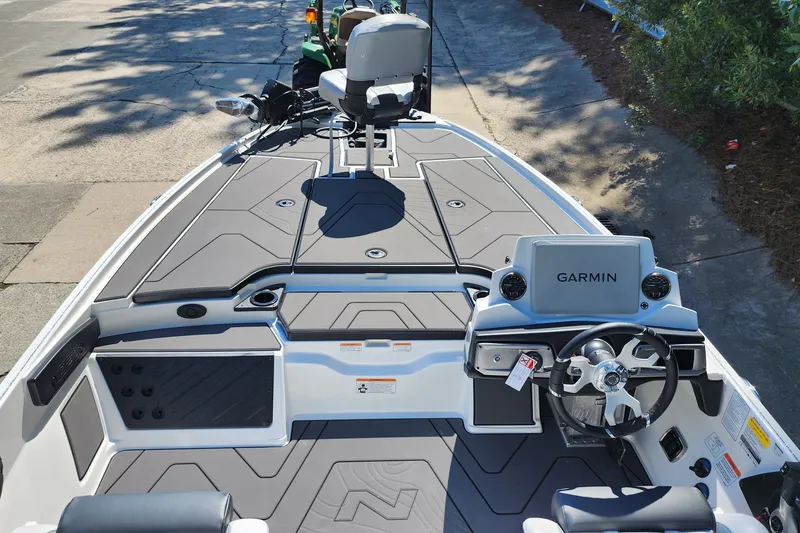Slide: The Image of 2027 Nitro Z20 XL Pro boat interior with Garmin navigation system and sleek seating. - 8