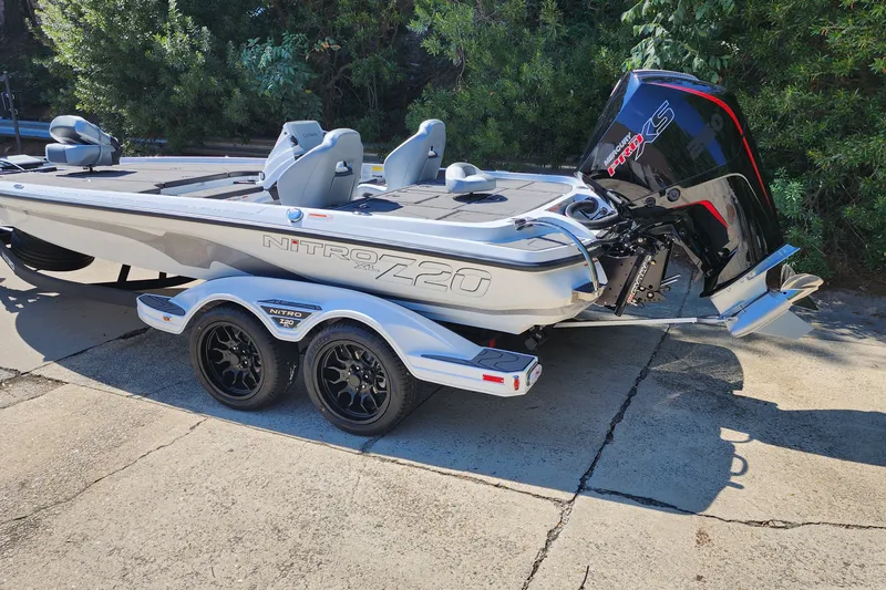 Slide: The Image of 2027 Nitro Z20 XL Pro boat with sleek design and powerful engine, parked outdoors. - 2