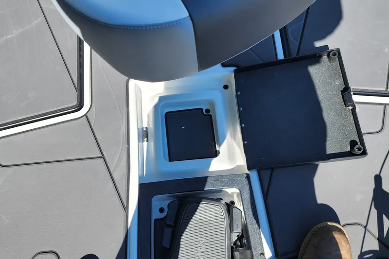 Slide: The Image of Interior view of a 2027 Nitro Z20 XL Pro boat, featuring seating and storage compartments. - 9