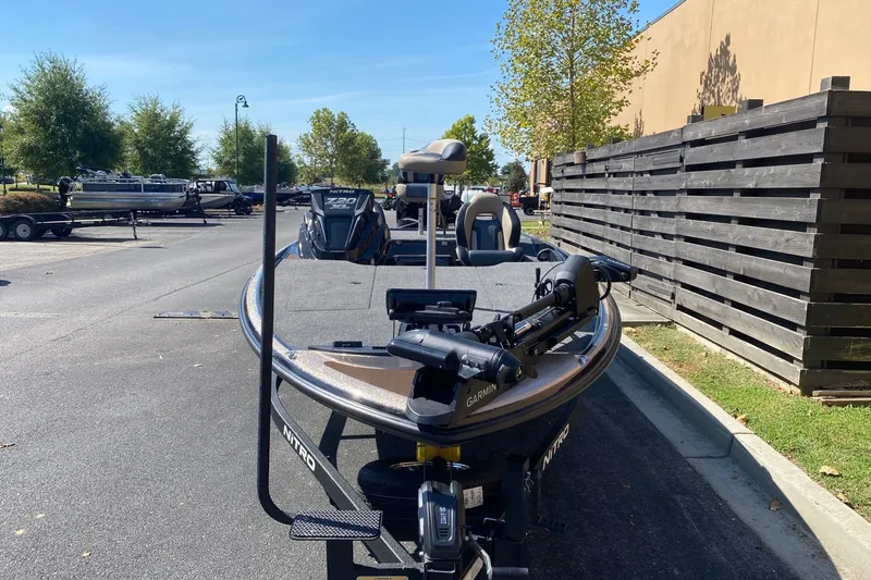 Slide: The Image of 2027 Nitro Z20 XL Pro boat parked outdoors, featuring advanced Garmin equipment. - 5