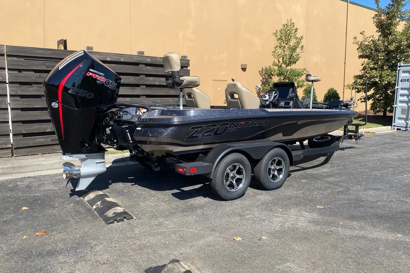 Slide: The Image of 2027 Nitro Z20 XL Pro boat with Mercury Pro XS engine, parked outdoors. - 1