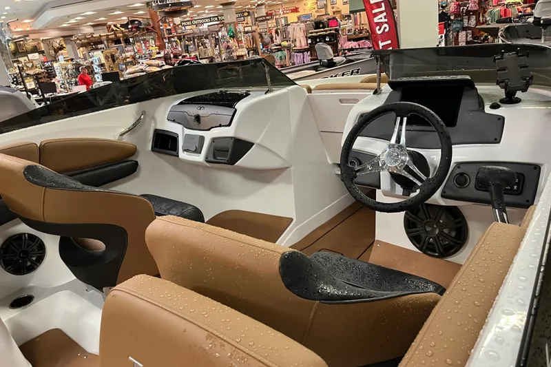 Slide: The Image of Interior of 2027 Tahoe 210 S boat with modern dashboard and seating. - 7