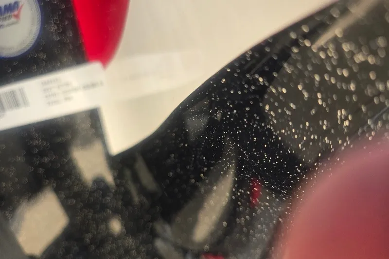 Slide: The Image of Close-up of a Nitro Z21 XL Pro 2027 with water droplets on a glossy surface. - 67