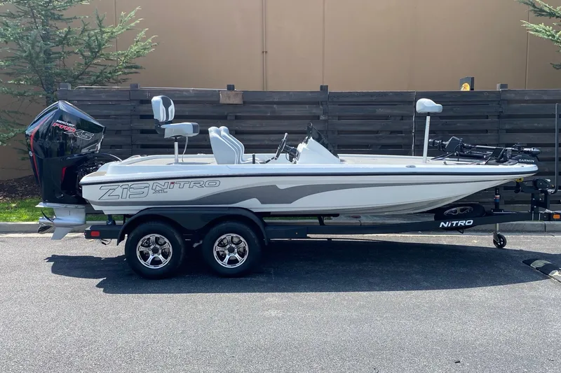 The Image of 2027 Nitro Z19 XL Pro boat on trailer, side view, outdoors. - 0