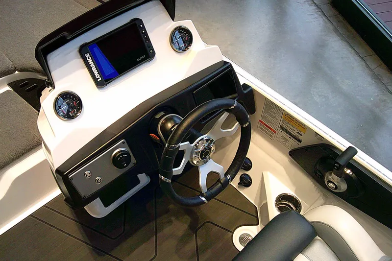 Slide: The Image of Cockpit of 2027 Nitro Z21 XL boat with steering wheel and digital display. - 7