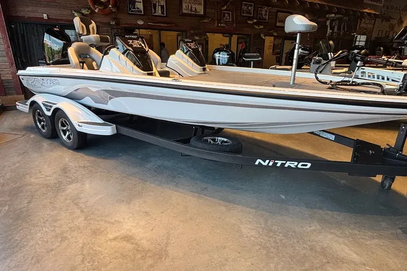Slide: The Image of 2027 Nitro Z21 XL boat on trailer in showroom setting. - 3