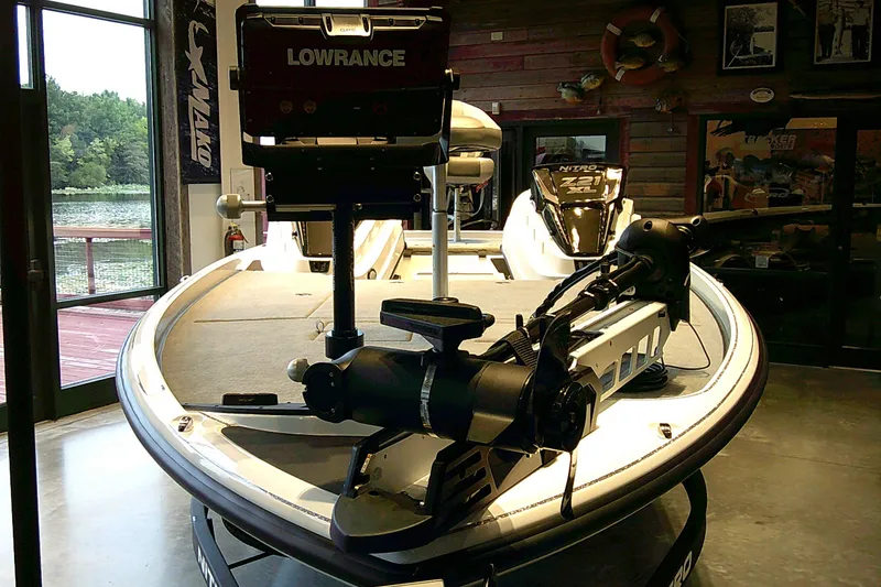 Slide: The Image of 2027 Nitro Z21 XL boat with Lowrance equipment in showroom setting. - 8