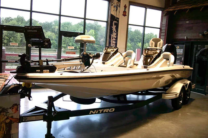 The Image of 2027 Nitro Z21 XL boat displayed indoors with advanced fishing equipment. - 0
