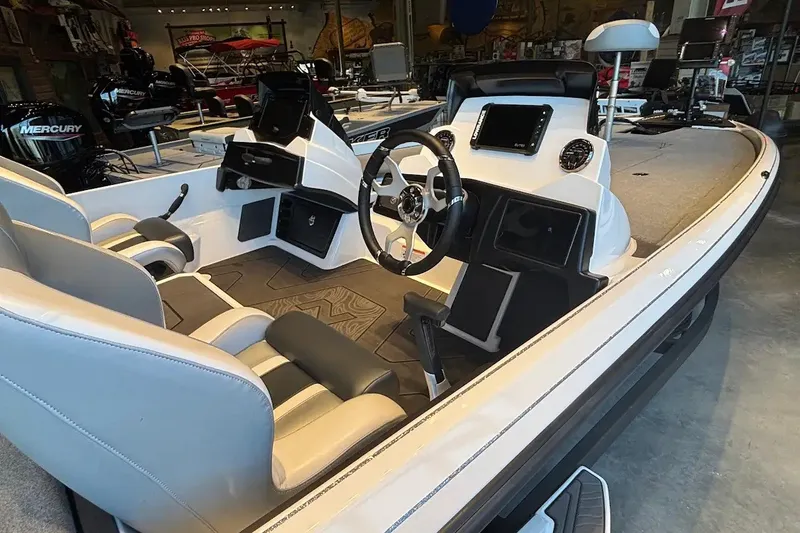Slide: The Image of Interior view of a 2027 Nitro Z21 XL boat with modern steering and seating. - 14
