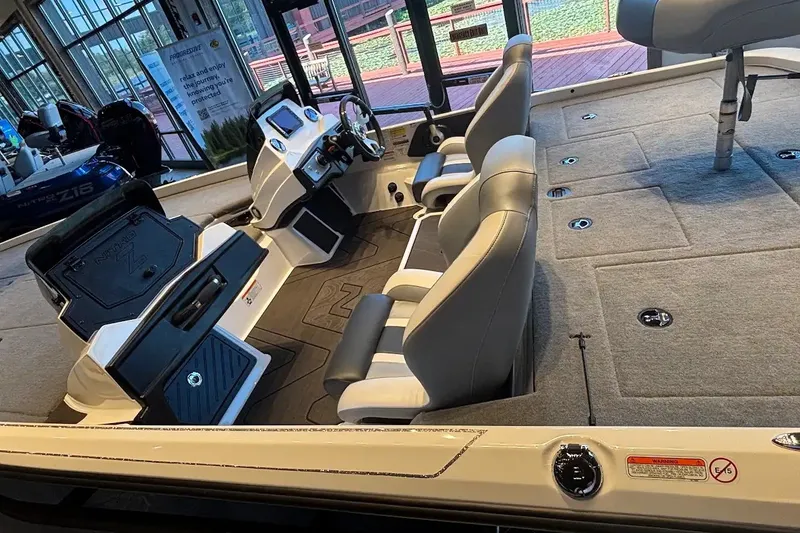 Slide: The Image of 2027 Nitro Z21 XL boat interior with modern seating and control console. - 17