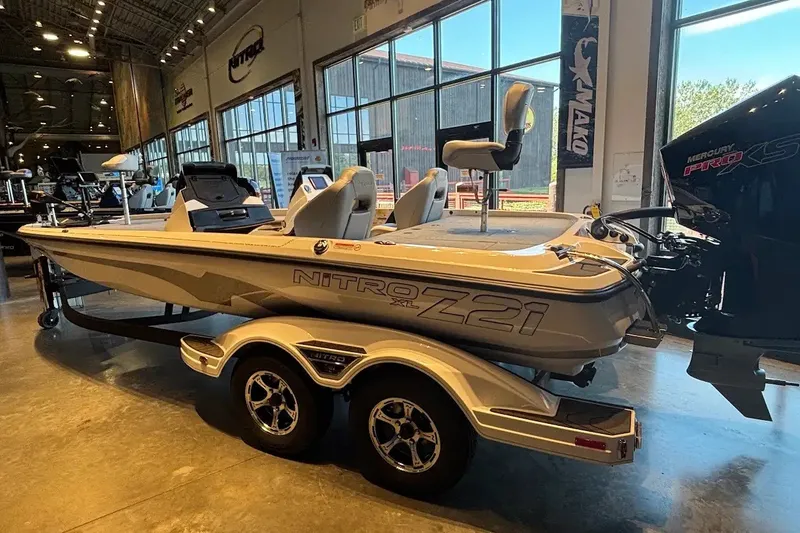 Slide: The Image of 2027 Nitro Z21 XL boat displayed indoors, featuring sleek design and Mercury Pro XS engine. - 4