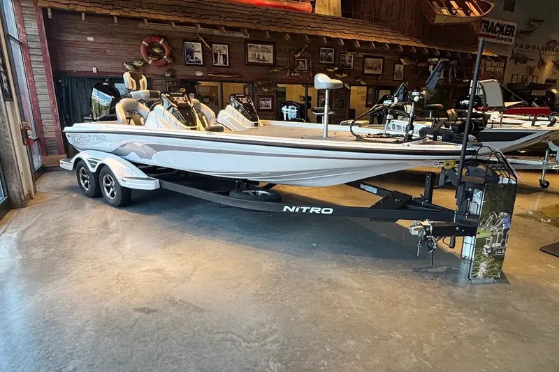 Slide: The Image of 2027 Nitro Z21 XL boat displayed indoors on a trailer. - 2