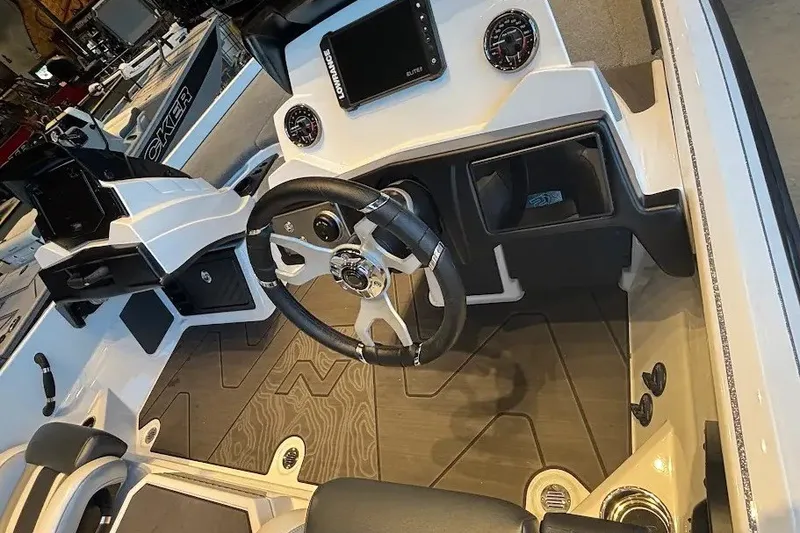 Slide: The Image of 2027 Nitro Z21 XL boat interior with steering wheel and dashboard controls. - 16