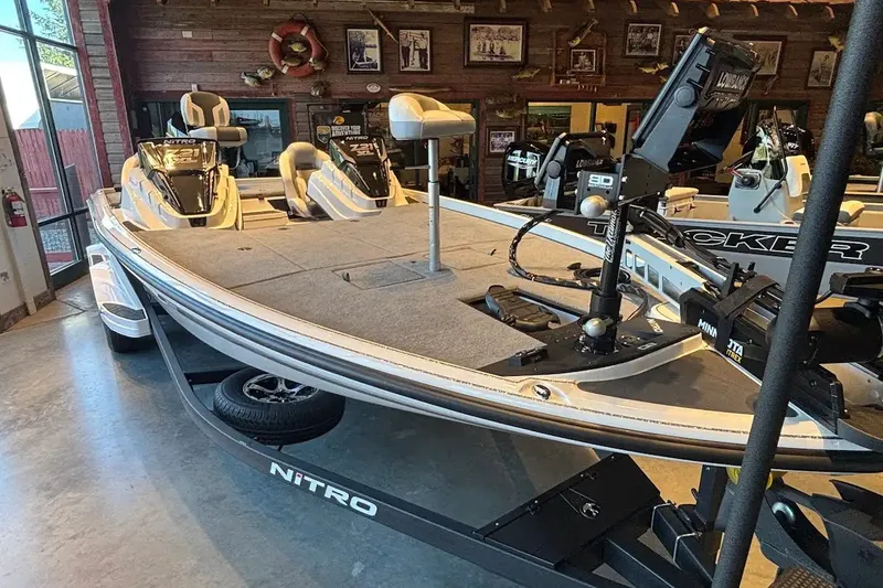 Slide: The Image of 2027 Nitro Z21 XL boat displayed indoors, featuring advanced fishing equipment. - 13