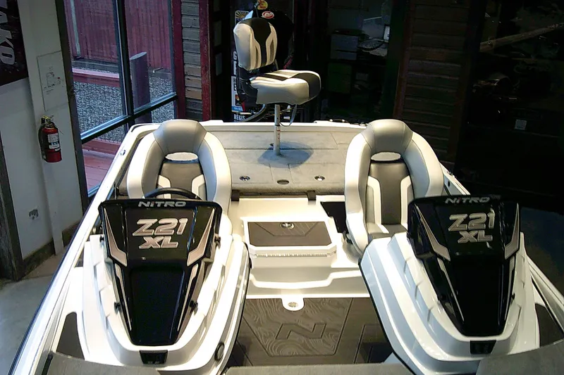 Slide: The Image of 2027 Nitro Z21 XL boat interior with dual seats and elevated fishing chair. - 6