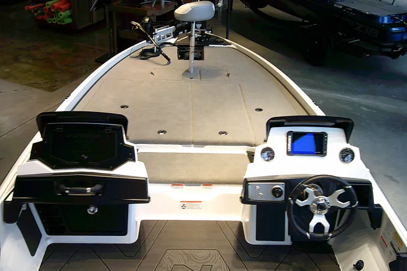 Slide: The Image of 2027 Nitro Z21 XL boat interior with steering wheel and dashboard controls. - 5