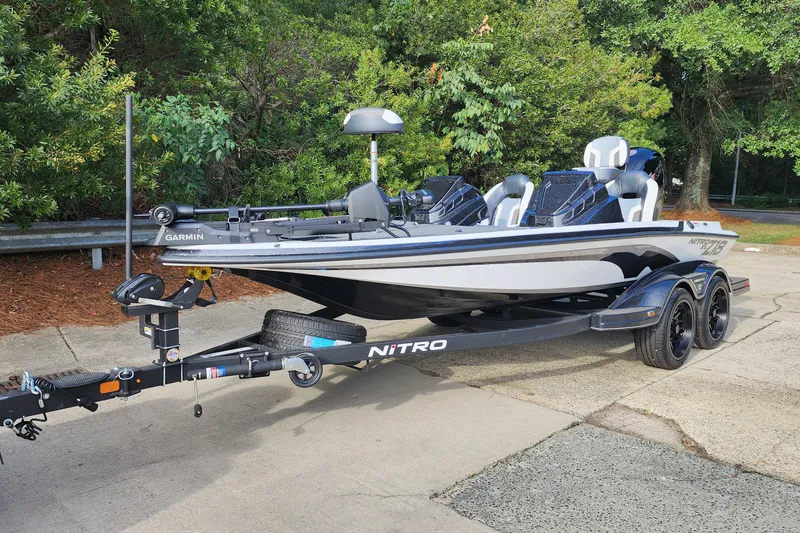 Slide: The Image of 2027 Nitro Z18 XL Pro fishing boat on trailer, parked outdoors. - 1