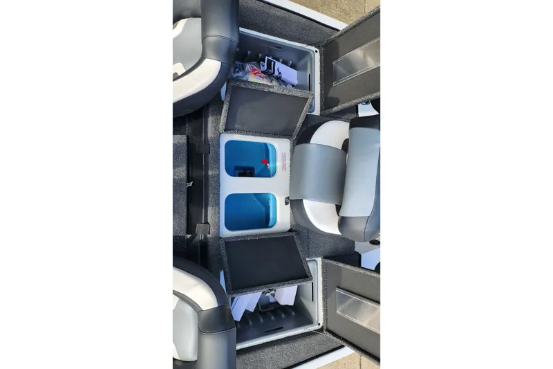 Slide: The Image of 2027 Nitro Z18 XL Pro boat interior with open storage compartments and seating. - 62