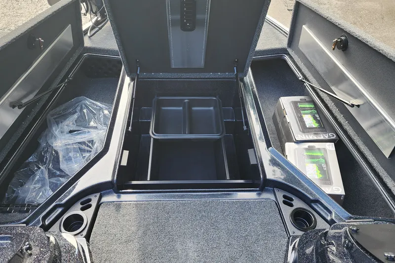 Slide: The Image of Interior storage compartment of 2027 Nitro Z18 XL Pro boat with batteries and equipment. - 8