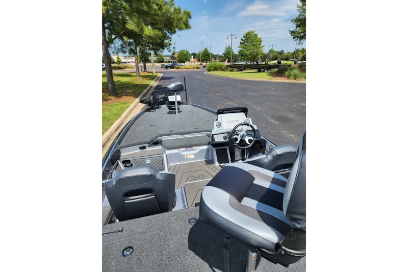 Slide: The Image of 2027 Nitro Z21 XL Pro boat interior with steering wheel and seating. - 7