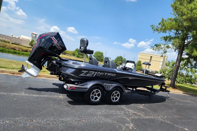 The Image of 2027 Nitro Z21 XL Pro boat parked outdoors on a sunny day. - 0