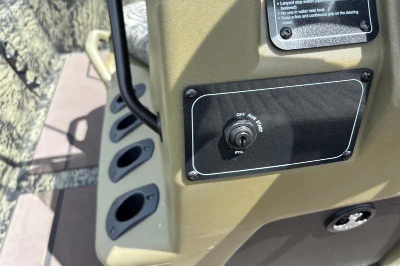 Slide: The Image of Control panel of 2027 Tracker Grizzly 1860 CC boat with ignition switch. - 16