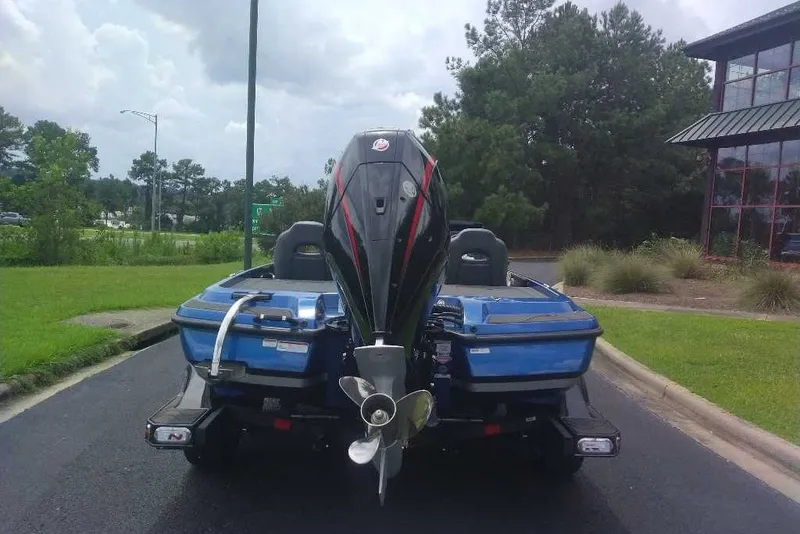 Slide: The Image of 2027 Nitro Z21 XL boat with powerful outboard motor on a paved road. - 10