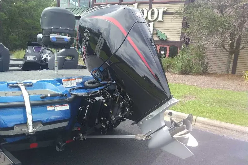 Slide: The Image of 2027 Nitro Z21 XL boat with powerful outboard motor, parked outdoors. - 9