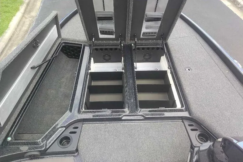 Slide: The Image of 2027 Nitro Z21 XL boat storage compartments with open lids, showcasing organized interior space. - 7