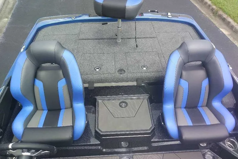 Slide: The Image of 2027 Nitro Z21 XL boat interior with blue and black seats. - 5