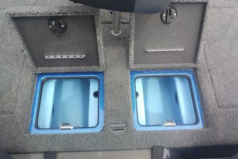 Slide: The Image of 2027 Nitro Z21 XL boat storage compartments with blue interior lining. - 6
