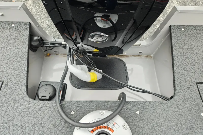 Slide: The Image of 2027 Tracker Pro Guide V-16 SC boat interior with motor and wiring details. - 33