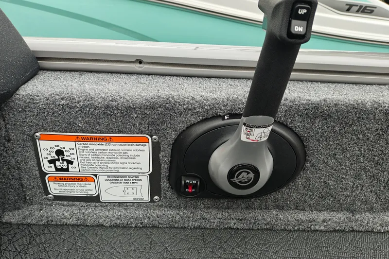 Slide: The Image of Control panel of 2027 Tracker Pro Guide V-16 SC boat with warning labels. - 17
