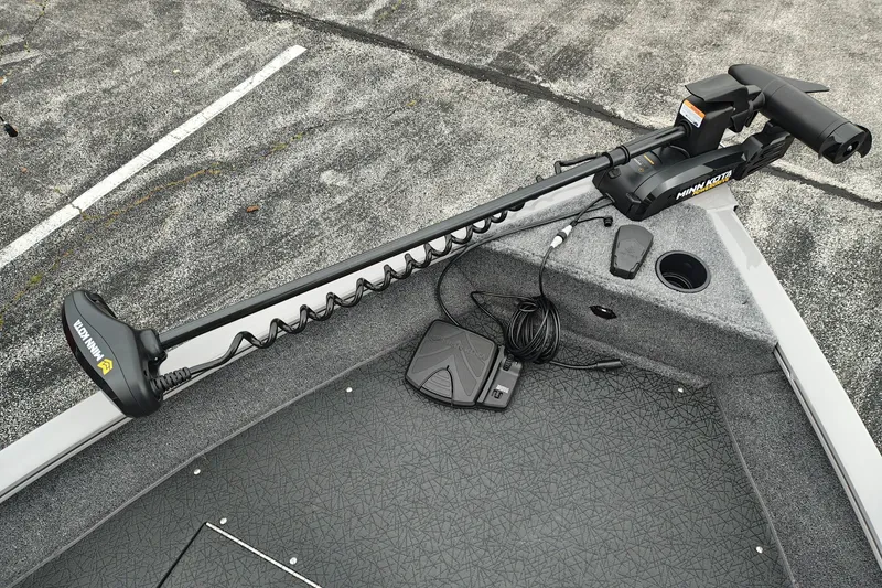 Slide: The Image of 2027 Tracker Pro Guide V-16 SC boat with Minn Kota trolling motor on deck. - 24