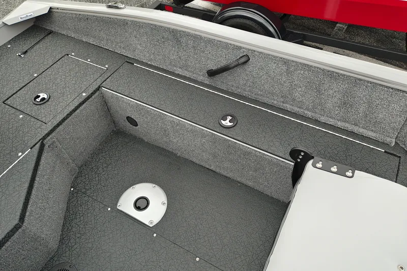 Slide: The Image of Interior of 2027 Tracker Pro Guide V-16 SC boat, featuring storage compartments and seating. - 27