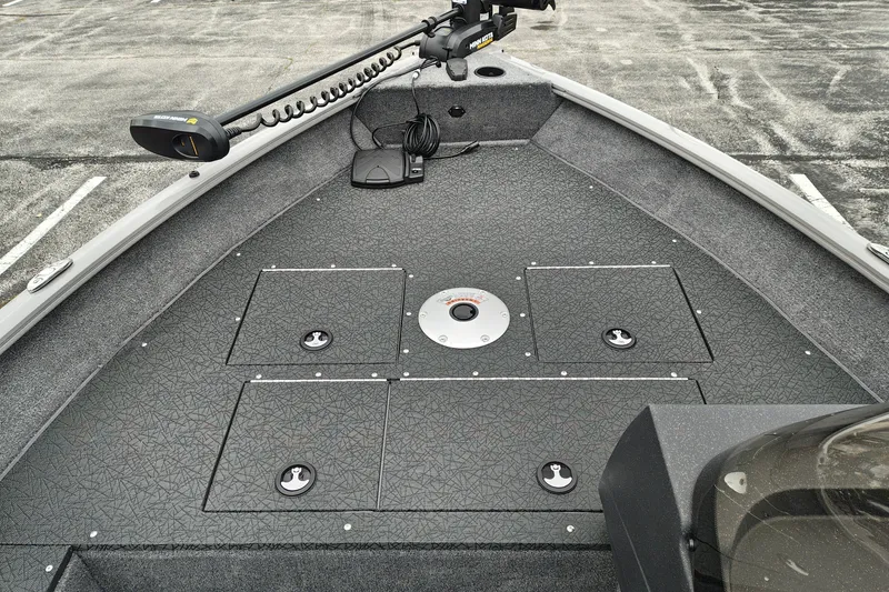 Slide: The Image of 2027 Tracker Pro Guide V-16 SC boat deck with storage compartments and trolling motor. - 20