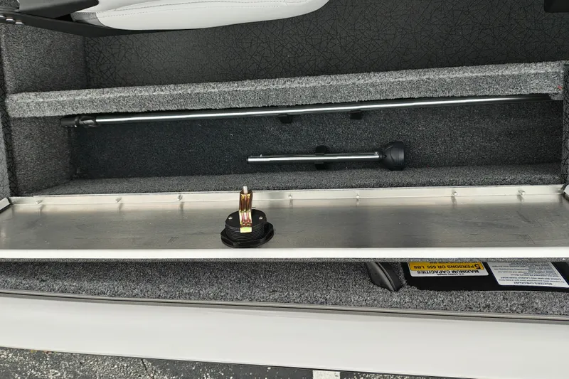 Slide: The Image of 2027 Tracker Pro Guide V-16 SC boat storage compartment with fishing rod holders and accessories. - 31