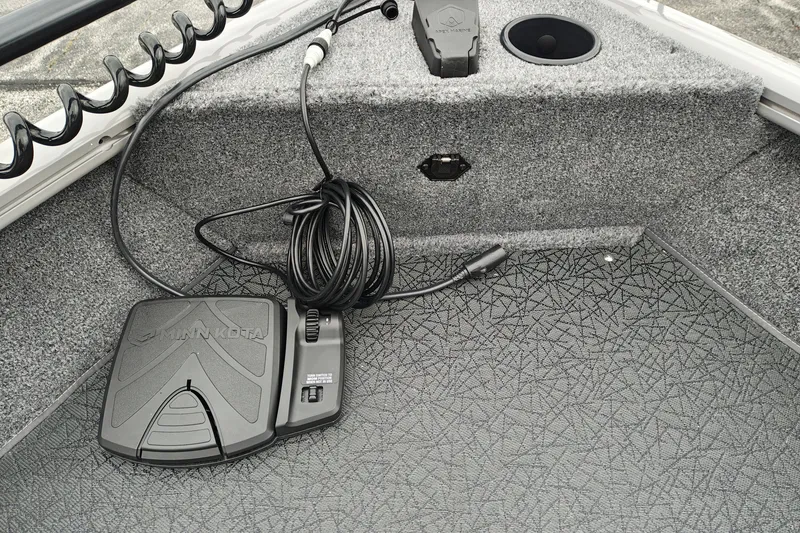 Slide: The Image of 2027 Tracker Pro Guide V-16 SC boat interior with Minn Kota foot pedal and wiring. - 25