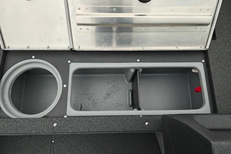 Slide: The Image of 2027 Tracker Pro Guide V-16 SC boat storage compartments, featuring circular and rectangular sections. - 22