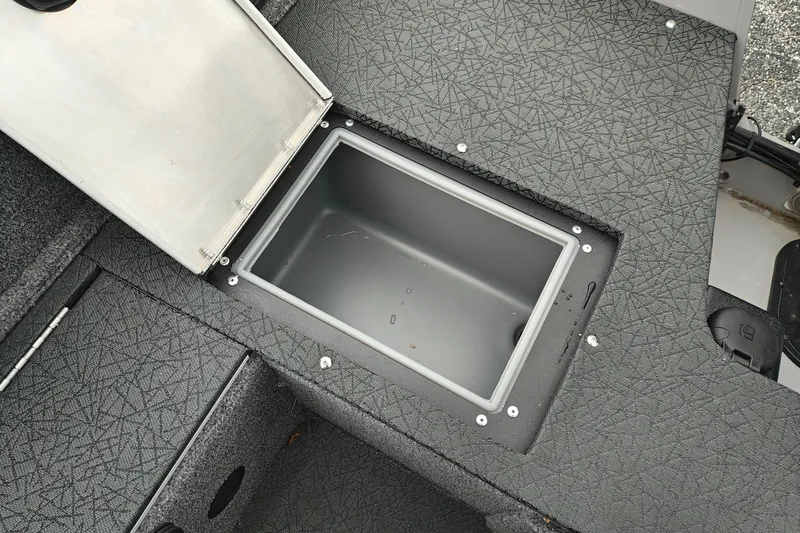 Slide: The Image of Storage compartment of 2027 Tracker Pro Guide V-16 SC boat, open and empty. - 32