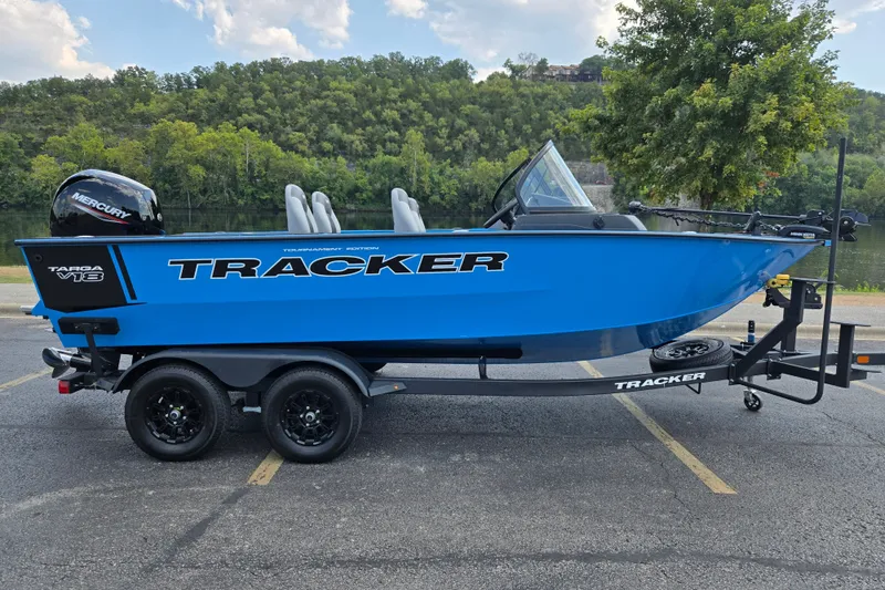 The Image of 2027 Tracker Targa V-18 Combo boat on trailer, parked near a scenic lake. - 0