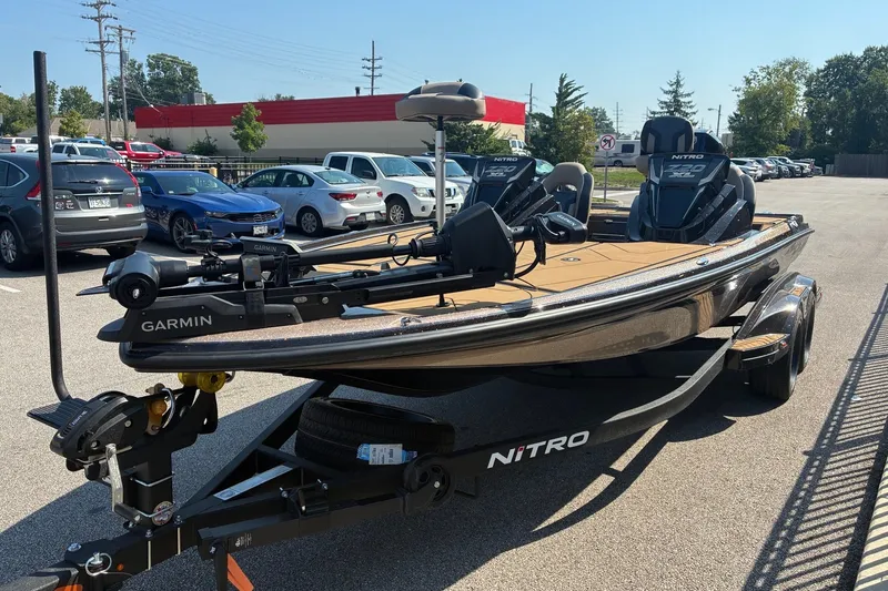 Slide: The Image of 2027 Nitro Z20 XL Pro boat with Garmin equipment in a parking lot. - 6