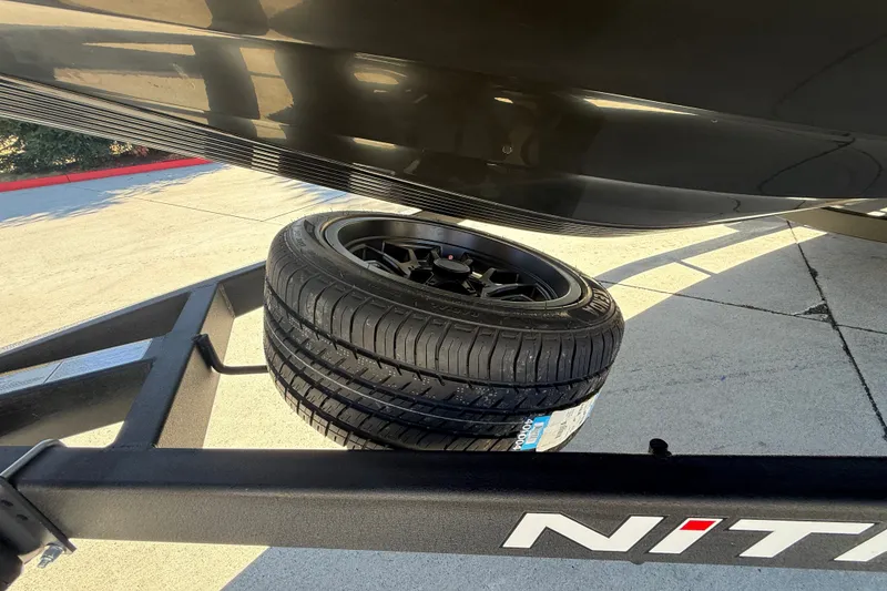 Slide: The Image of 2027 Nitro Z20 XL Pro trailer with spare tire mounted underneath. - 48