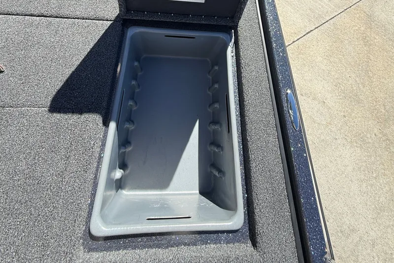 Slide: The Image of Storage compartment in 2027 Nitro Z20 XL Pro boat, featuring a sleek, carpeted interior. - 38